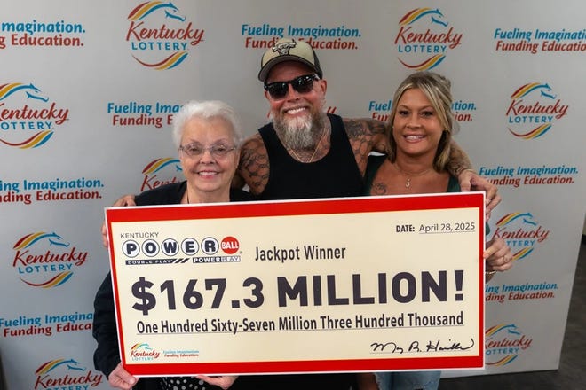 Linda Grizzle, James Farthing and Jacqueline Fightmaster pictured with the winnings from the Powerball.